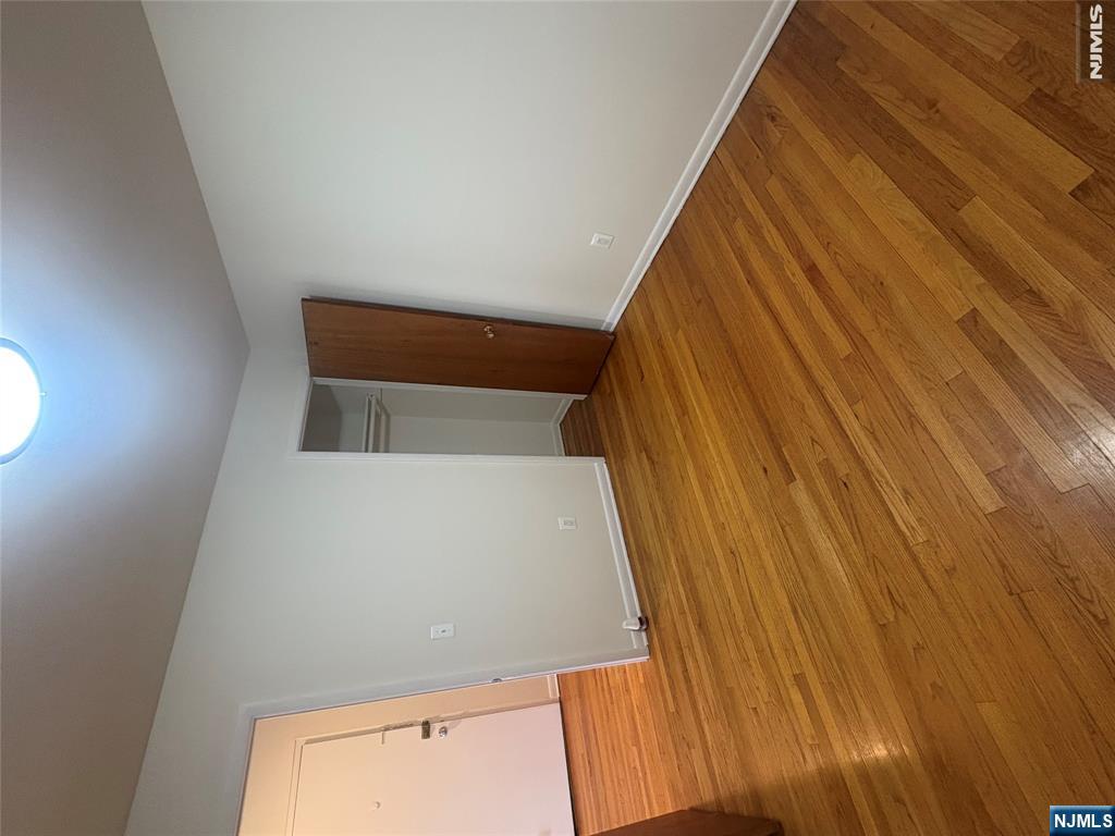 399 Walker Street, Unit 1B Fairview, NJ 07022 - Photo 10 of 11 a view of empty room