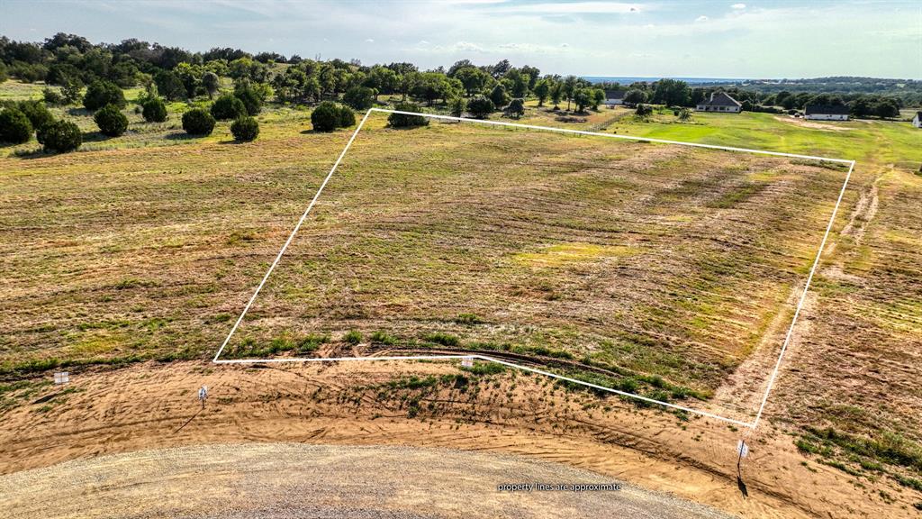 Lot 9-10 Three Quarter Loop Poolville, TX 76487 - Photo 2 of 14 a view of an ocean and beach