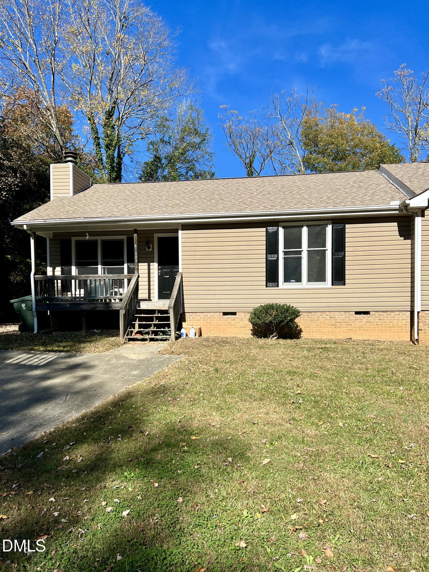 a house view with a garden space
