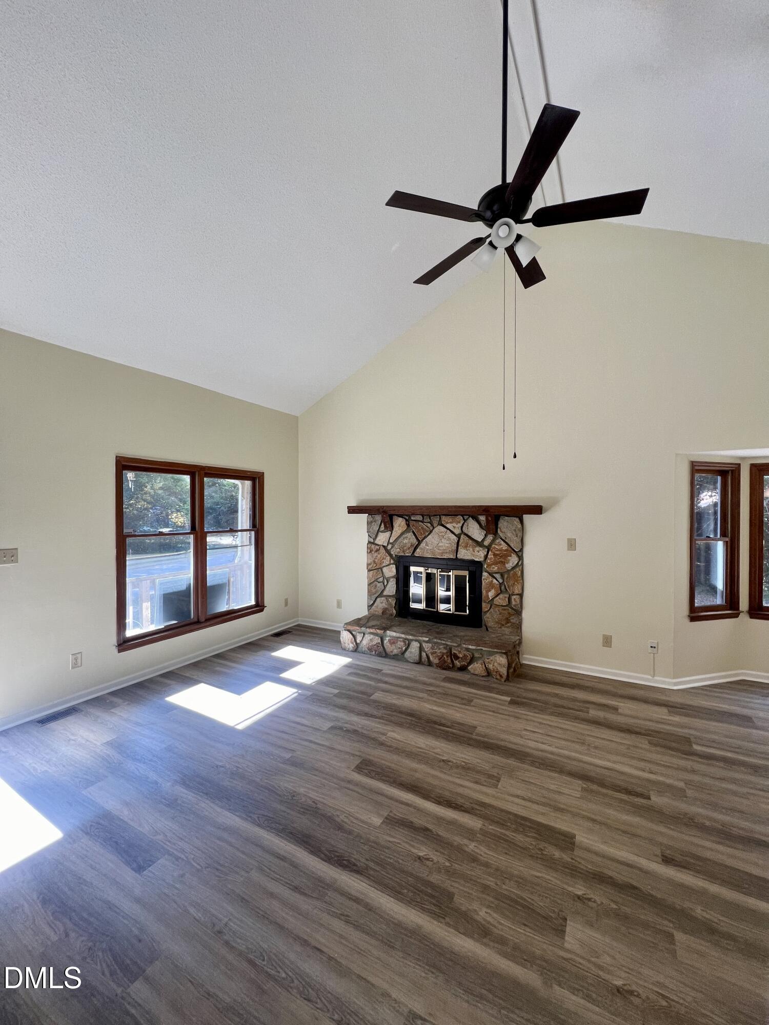 5132 Vann Street, Unit B Raleigh, NC 27606 - Photo 4 of 9 a view of an empty room with window and wooden floor