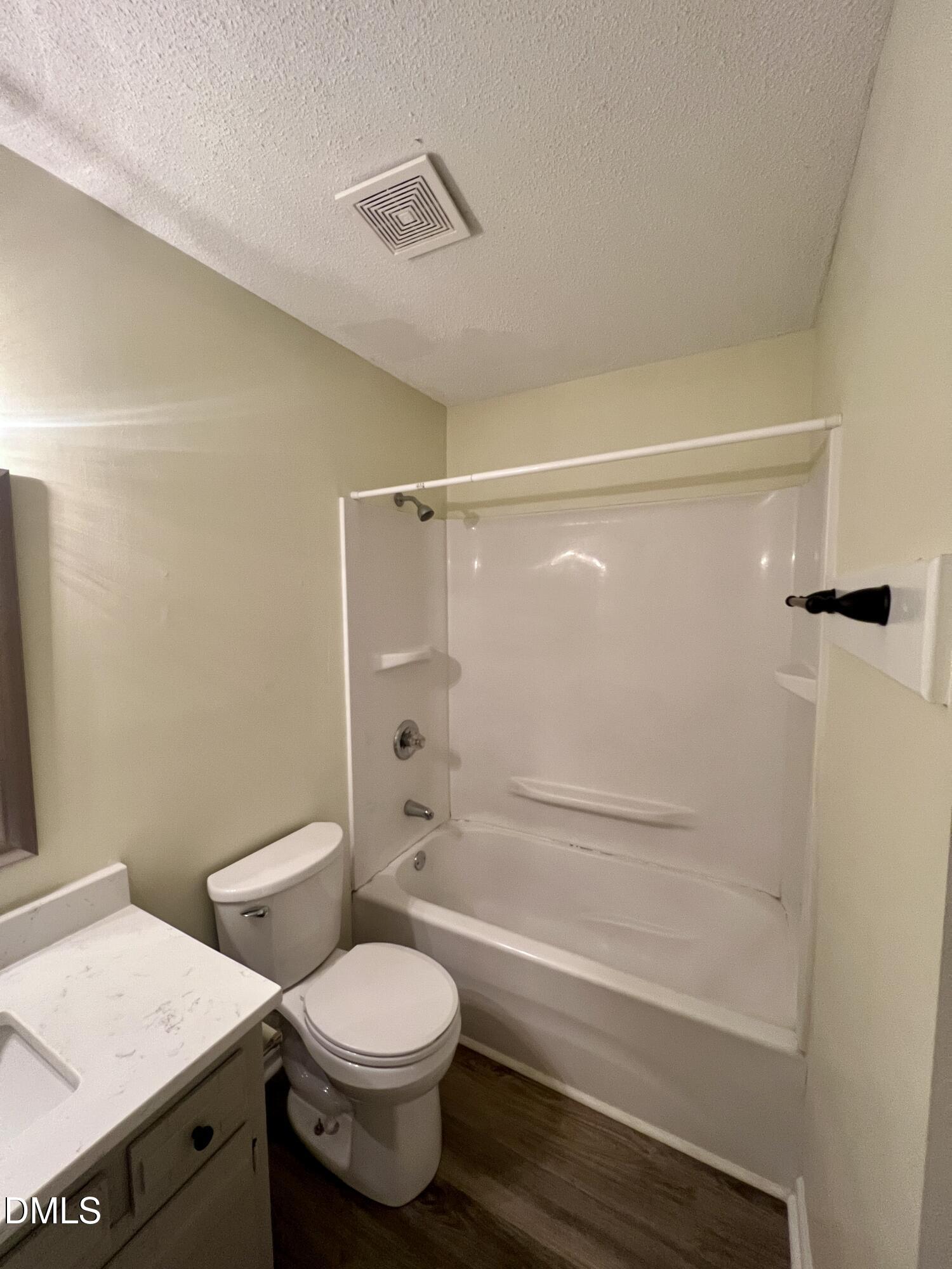 5132 Vann Street, Unit B Raleigh, NC 27606 - Photo 6 of 9 a bathroom with a toilet and a shower