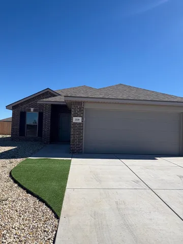a front view of a house with yard