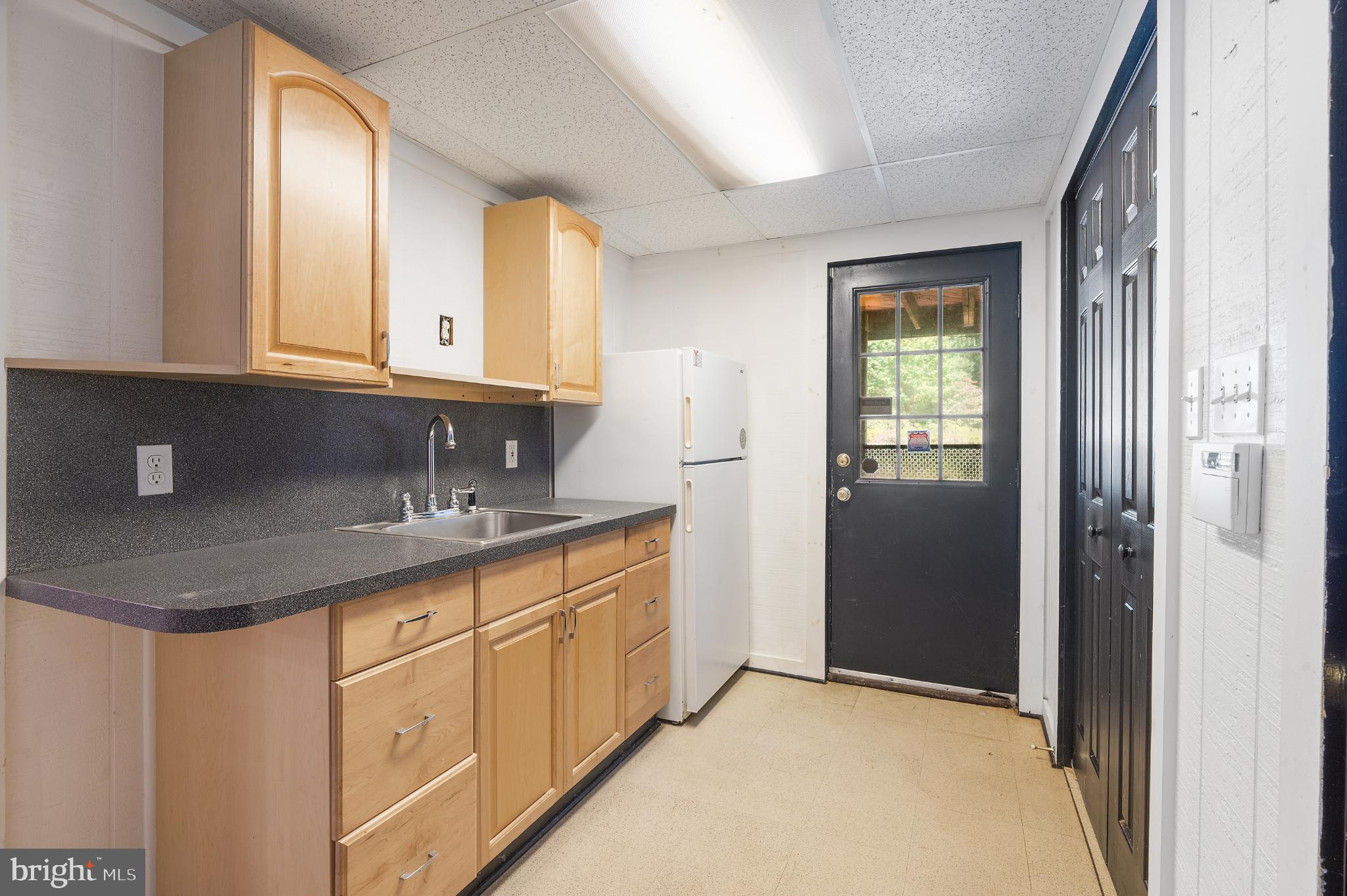 15729 Holly Grove Road Silver Spring, MD 20905 - Photo 76 of 83 Bright and functional kitchen space.