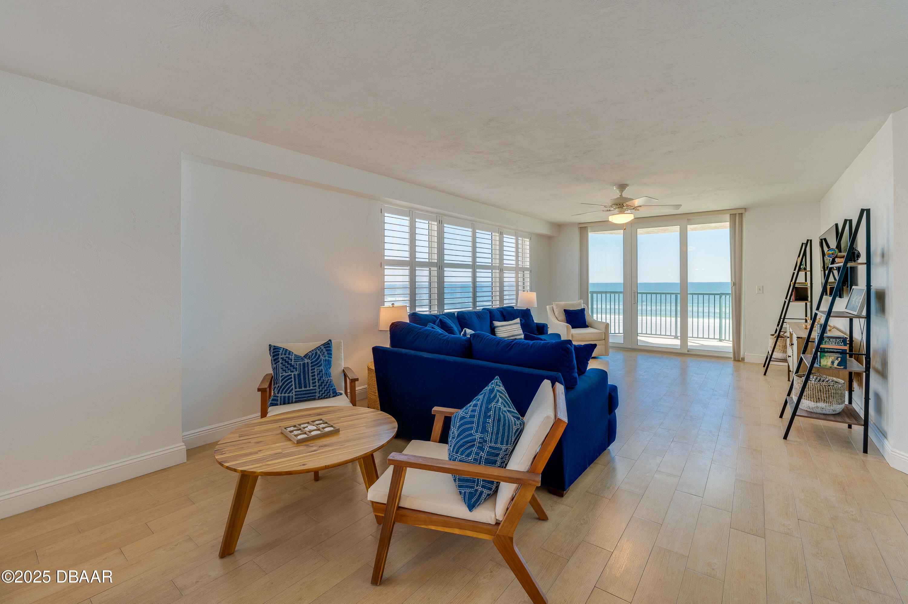 4545 South Atlantic Avenue, Unit 3206 Ponce Inlet, FL 32127 - Photo 12 of 35 a living room with furniture and a wooden floor