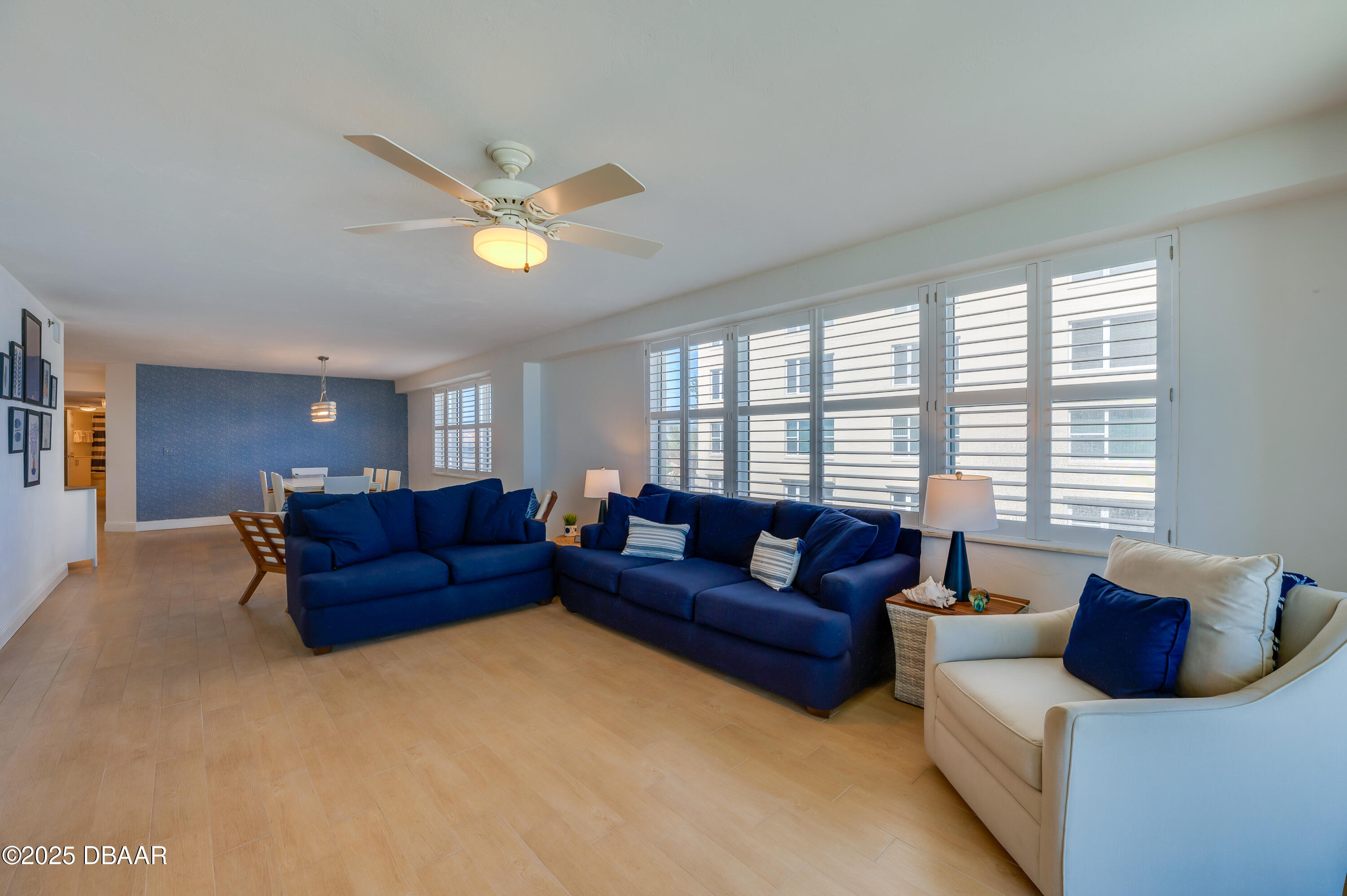 4545 South Atlantic Avenue, Unit 3206 Ponce Inlet, FL 32127 - Photo 15 of 35 a living room with furniture and a window