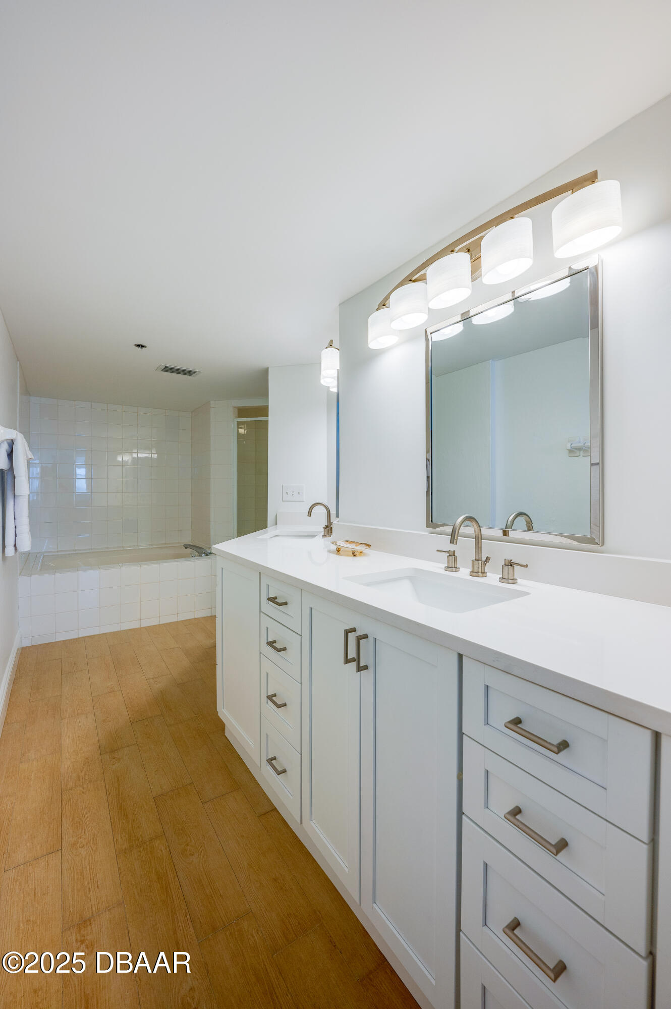 4545 South Atlantic Avenue, Unit 3206 Ponce Inlet, FL 32127 - Photo 20 of 35 a spacious bathroom with a double vanity sink and mirror