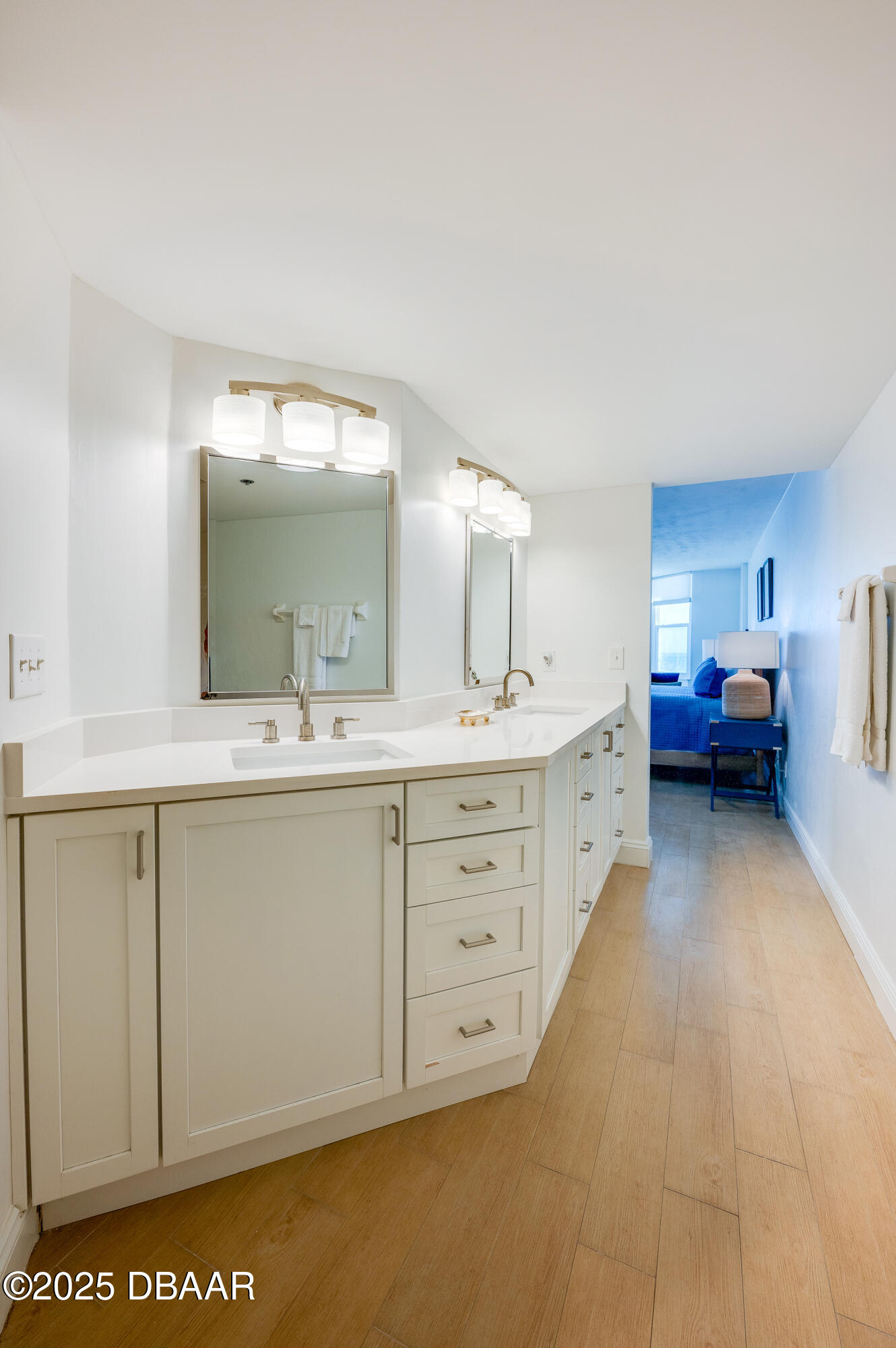4545 South Atlantic Avenue, Unit 3206 Ponce Inlet, FL 32127 - Photo 21 of 35 a spacious bathroom with a double vanity sink and a mirror
