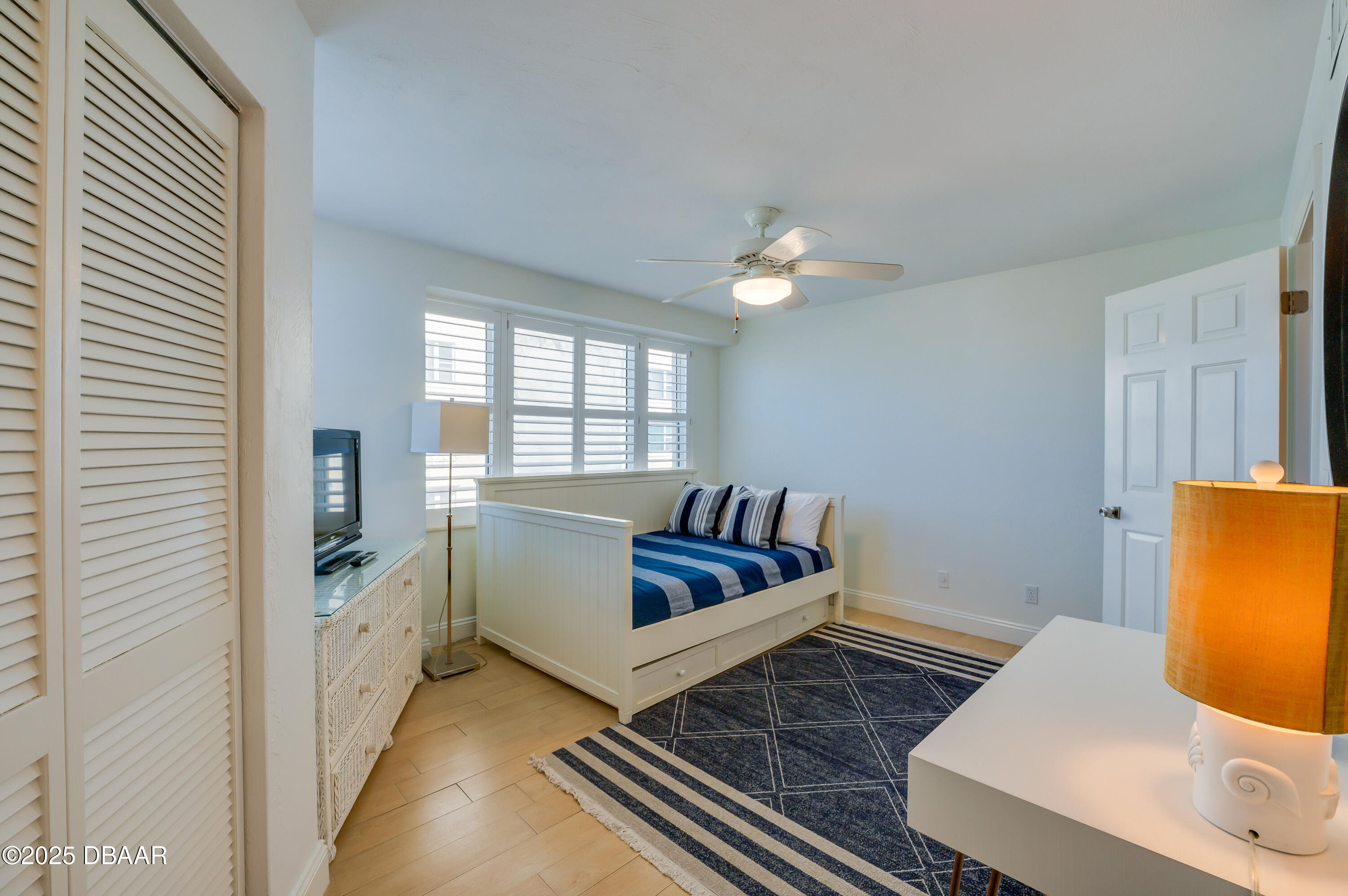 4545 South Atlantic Avenue, Unit 3206 Ponce Inlet, FL 32127 - Photo 25 of 35 a living room with furniture and a window