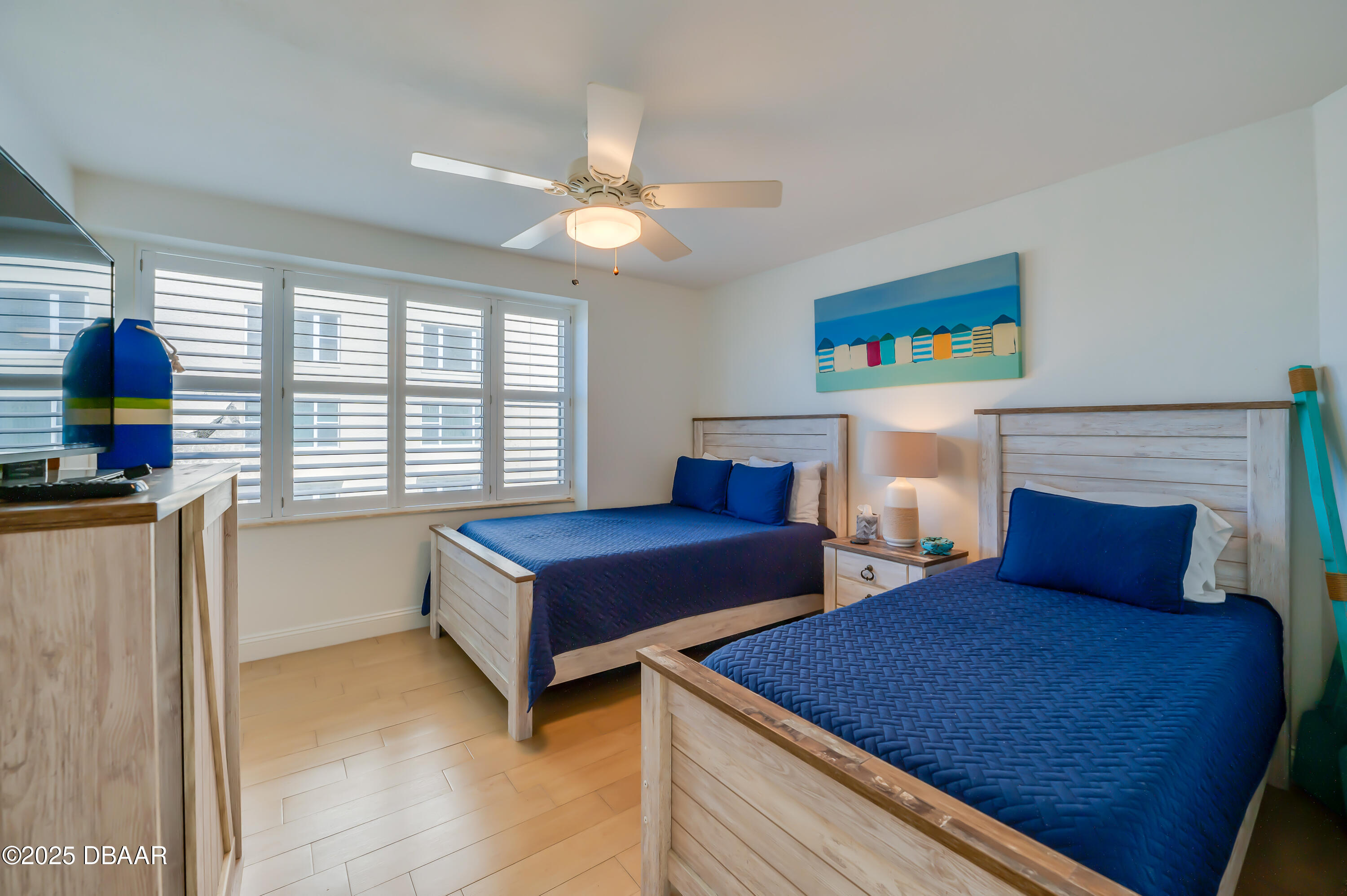 4545 South Atlantic Avenue, Unit 3206 Ponce Inlet, FL 32127 - Photo 27 of 35 a bedroom with furniture and a fireplace