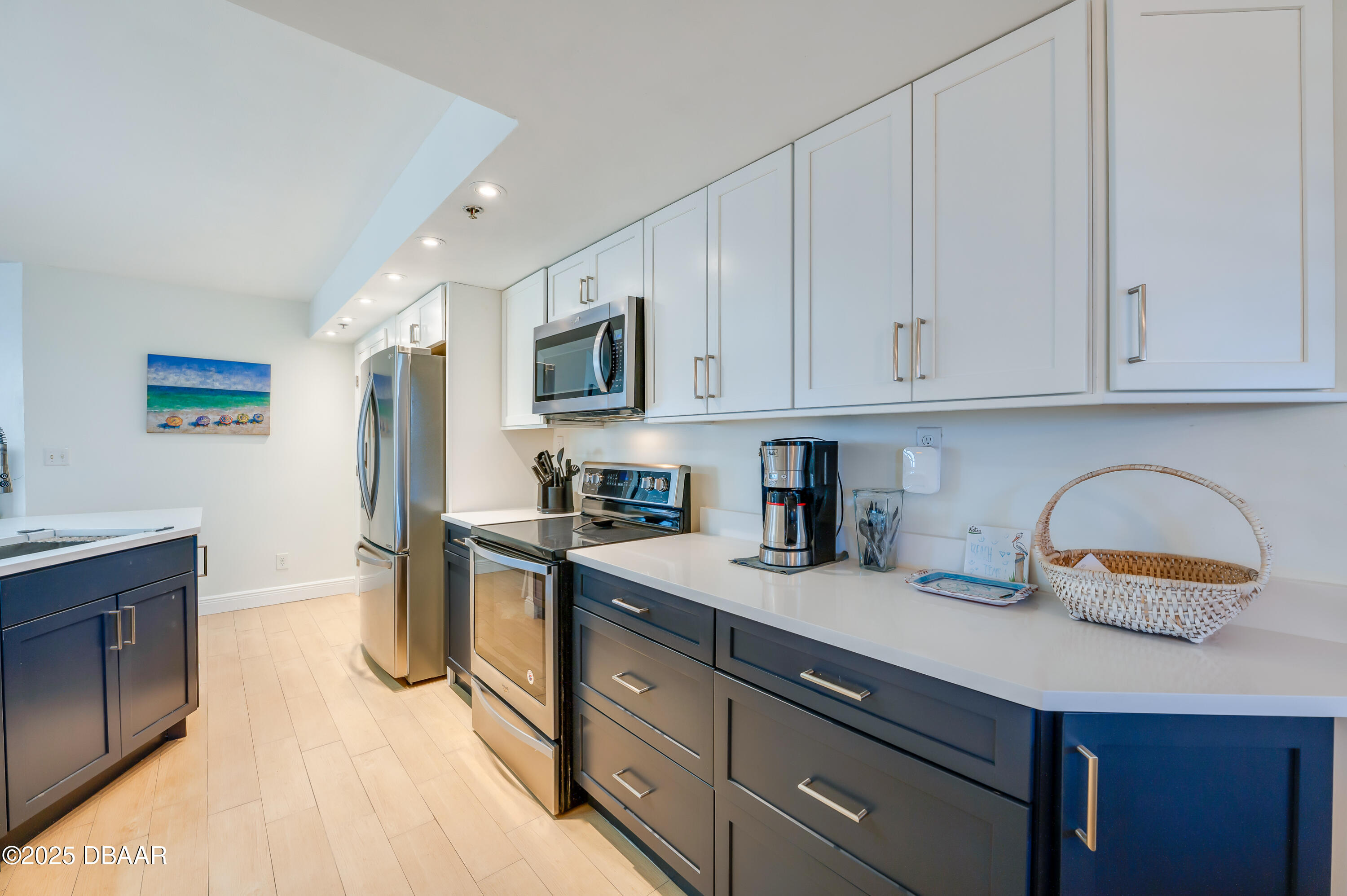 4545 South Atlantic Avenue, Unit 3206 Ponce Inlet, FL 32127 - Photo 6 of 35 a kitchen with a sink a stove and cabinets