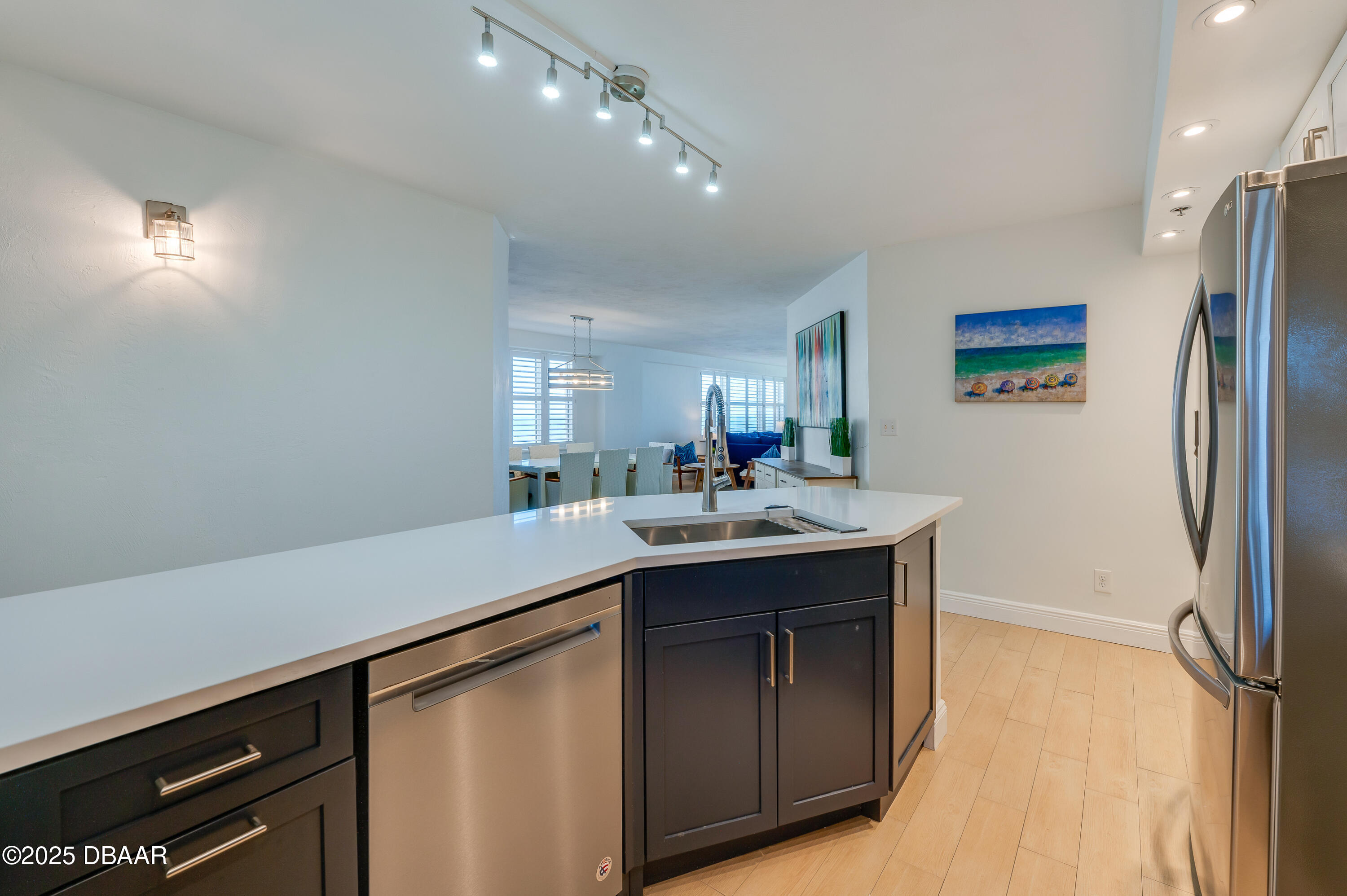 4545 South Atlantic Avenue, Unit 3206 Ponce Inlet, FL 32127 - Photo 7 of 35 a kitchen with a sink and refrigerator