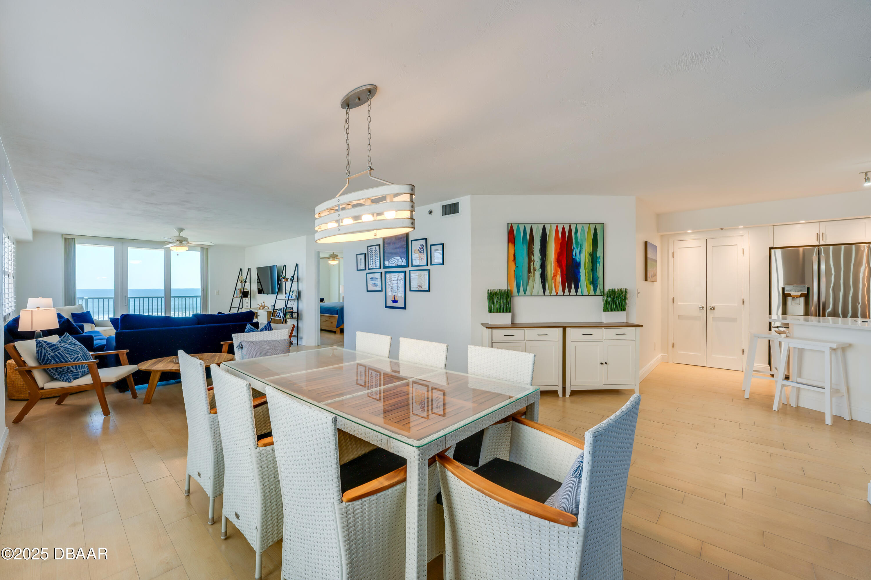 4545 South Atlantic Avenue, Unit 3206 Ponce Inlet, FL 32127 - Photo 10 of 35 a view of a dining room with furniture window and wooden floor
