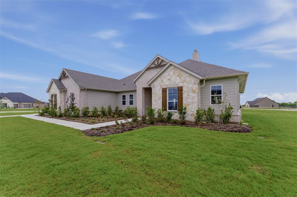 2204 Continent Court Krum, TX 76249 - Photo 4 of 28 Contemporary ranch-style exterior featuring a combination of stone veneer and horizontal siding