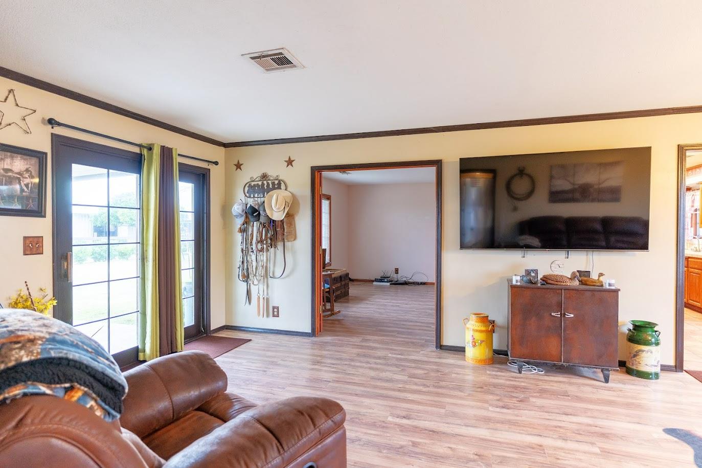 11175 East South Avenue Del Rey, CA 93616 - Photo 11 of 31 a living room with furniture and a flat screen tv
