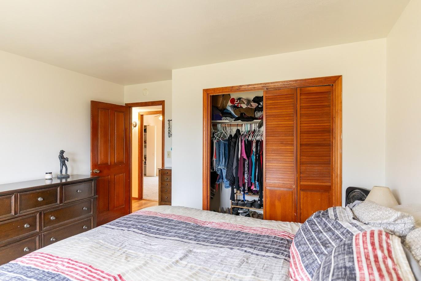 11175 East South Avenue Del Rey, CA 93616 - Photo 18 of 31 a bedroom with a bed and a closet