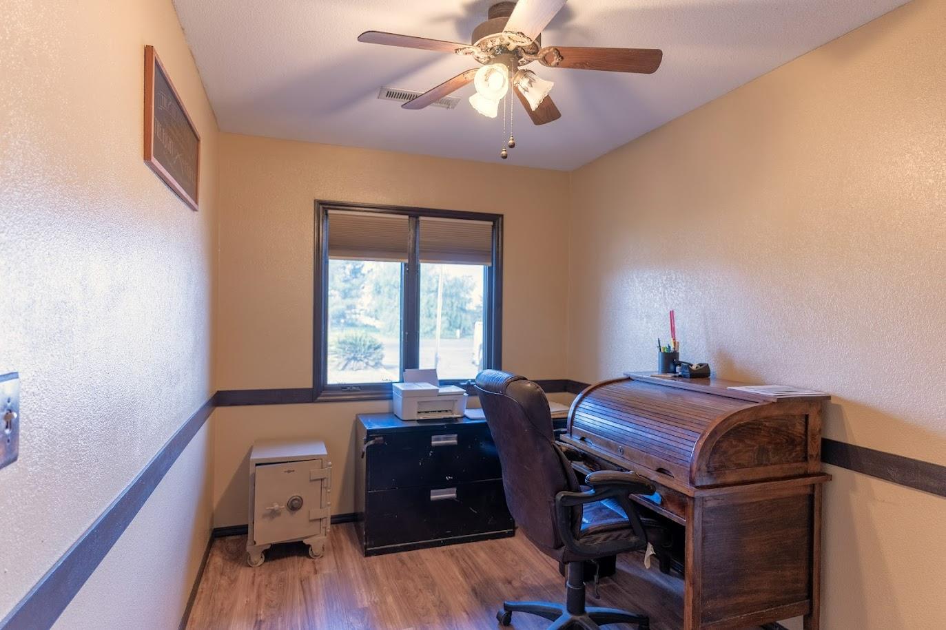 11175 East South Avenue Del Rey, CA 93616 - Photo 22 of 31 a view of a workspace with furniture and a window