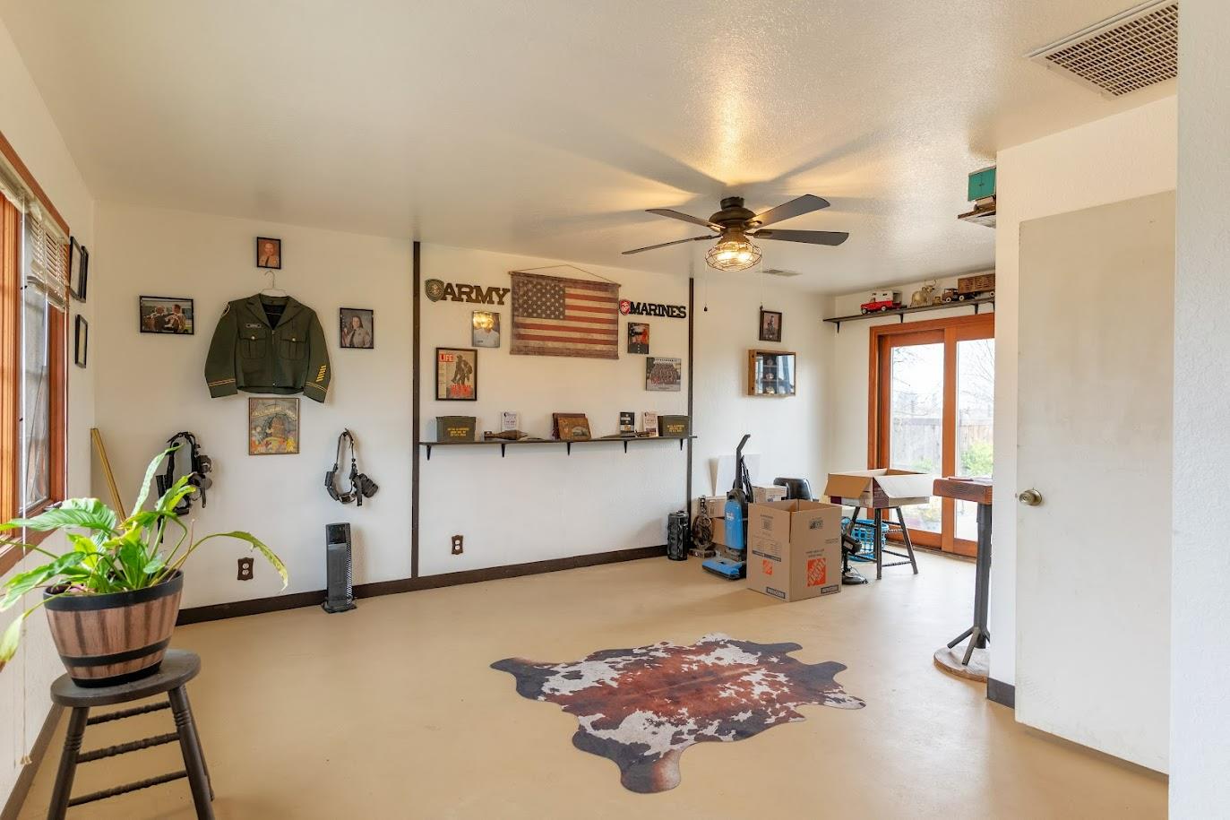 11175 East South Avenue Del Rey, CA 93616 - Photo 24 of 31 a living room with furniture and a flat screen tv