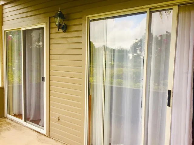 an empty room with wooden floor and a window