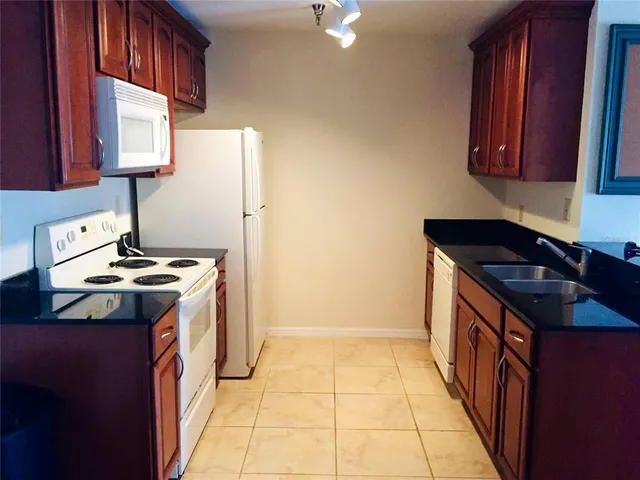 a kitchen with a stove and a sink