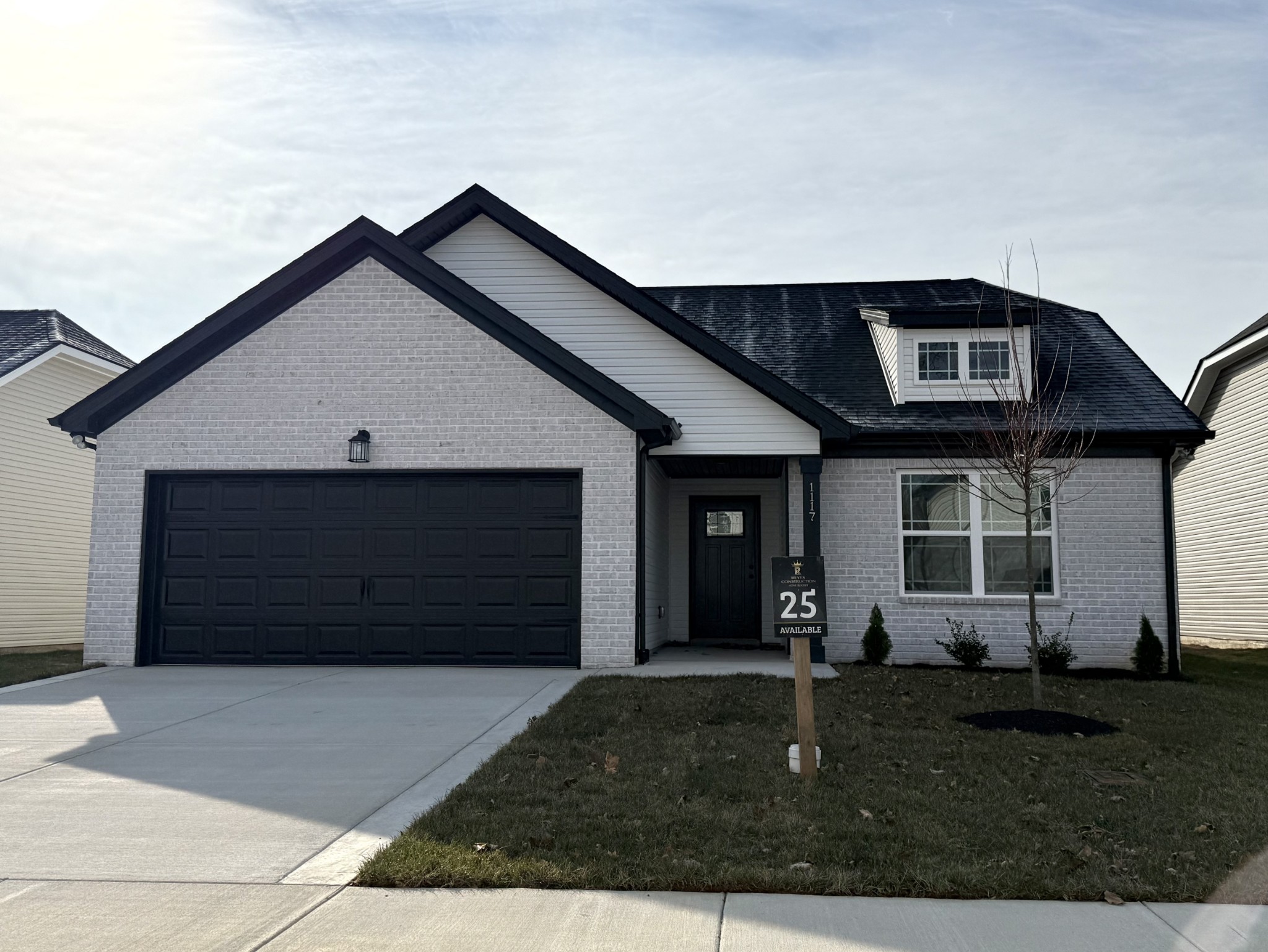 a front view of a house with a yard