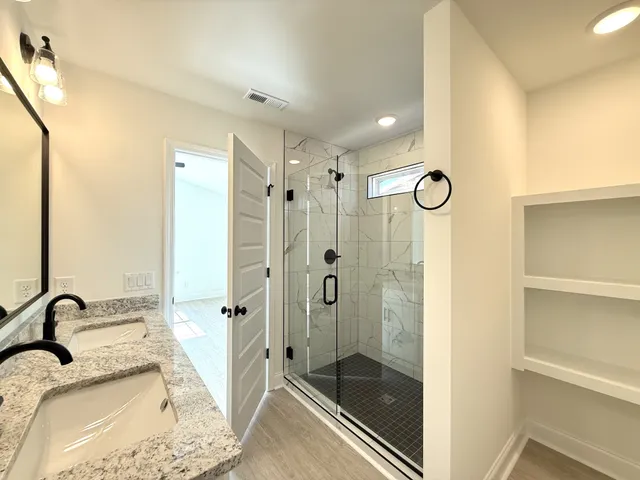 a bathroom with a sink and a shower