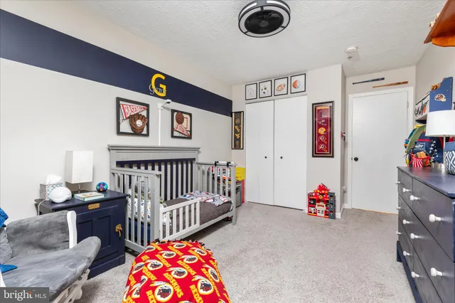 a bedroom with furniture and a chandelier