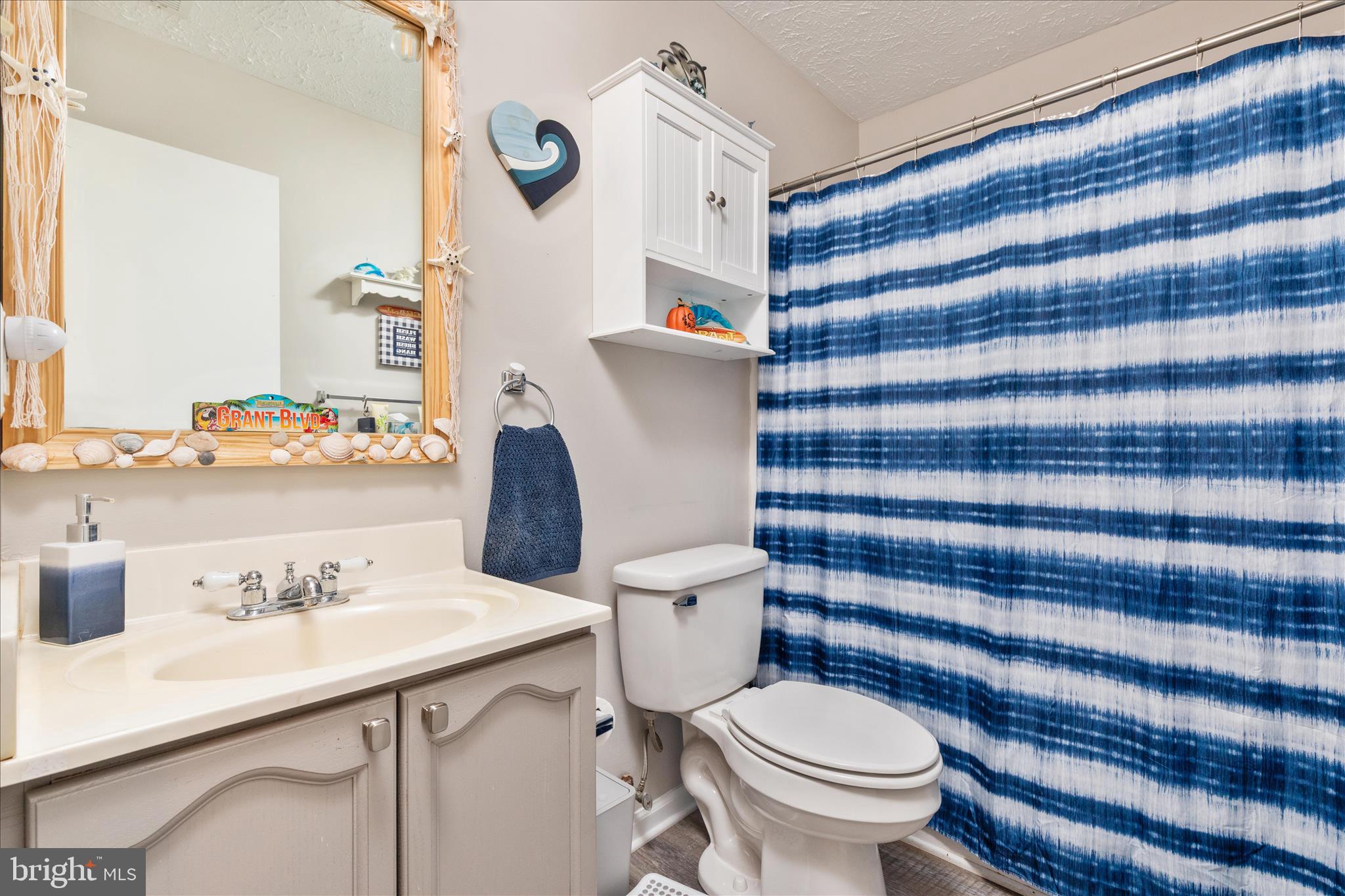157 Brookland Terrace, Unit 11 Winchester, VA 22602 - Photo 15 of 22 a bathroom with a sink toilet and shower