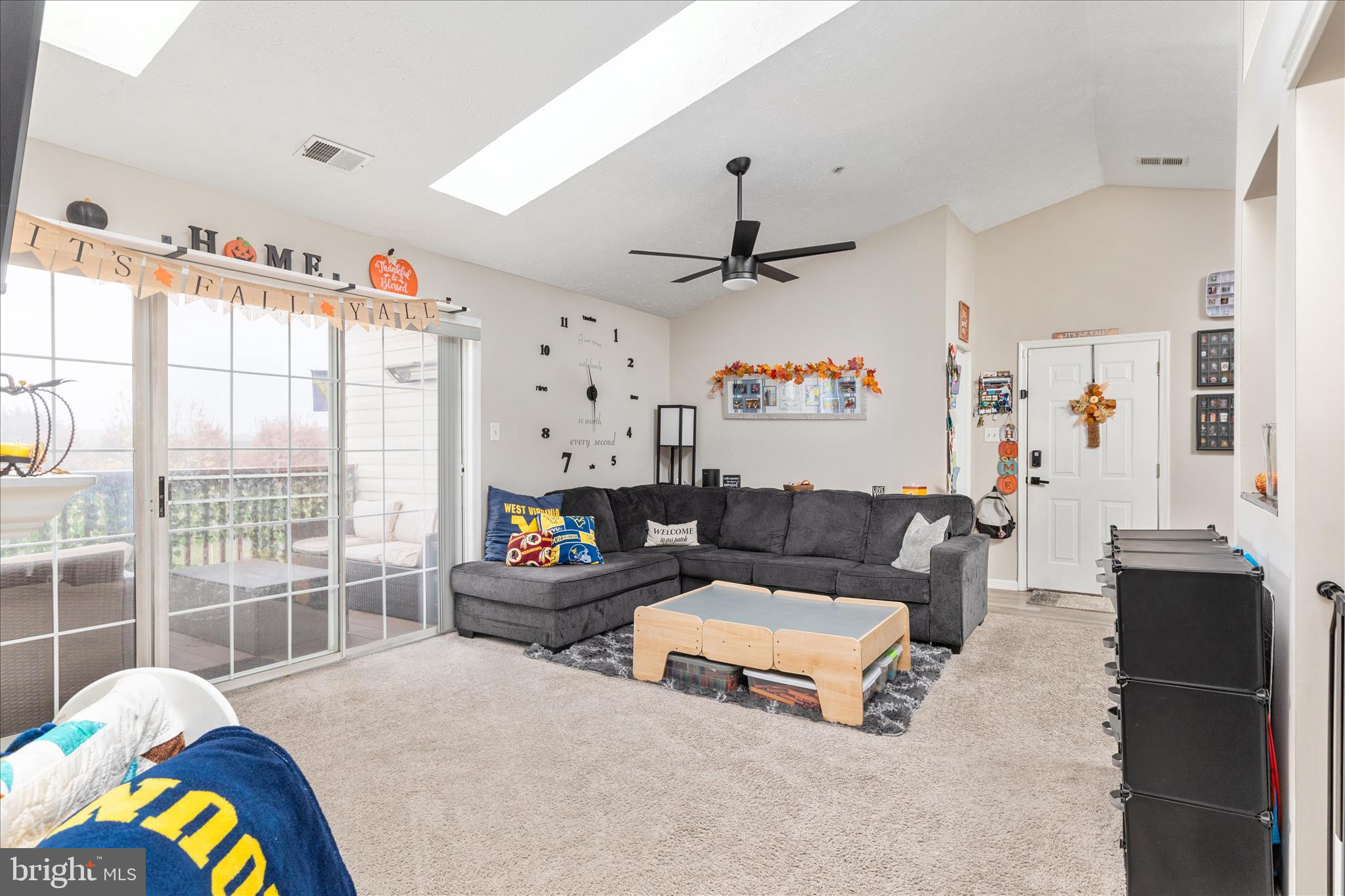 157 Brookland Terrace, Unit 11 Winchester, VA 22602 - Photo 6 of 22 a living room with furniture and a large window