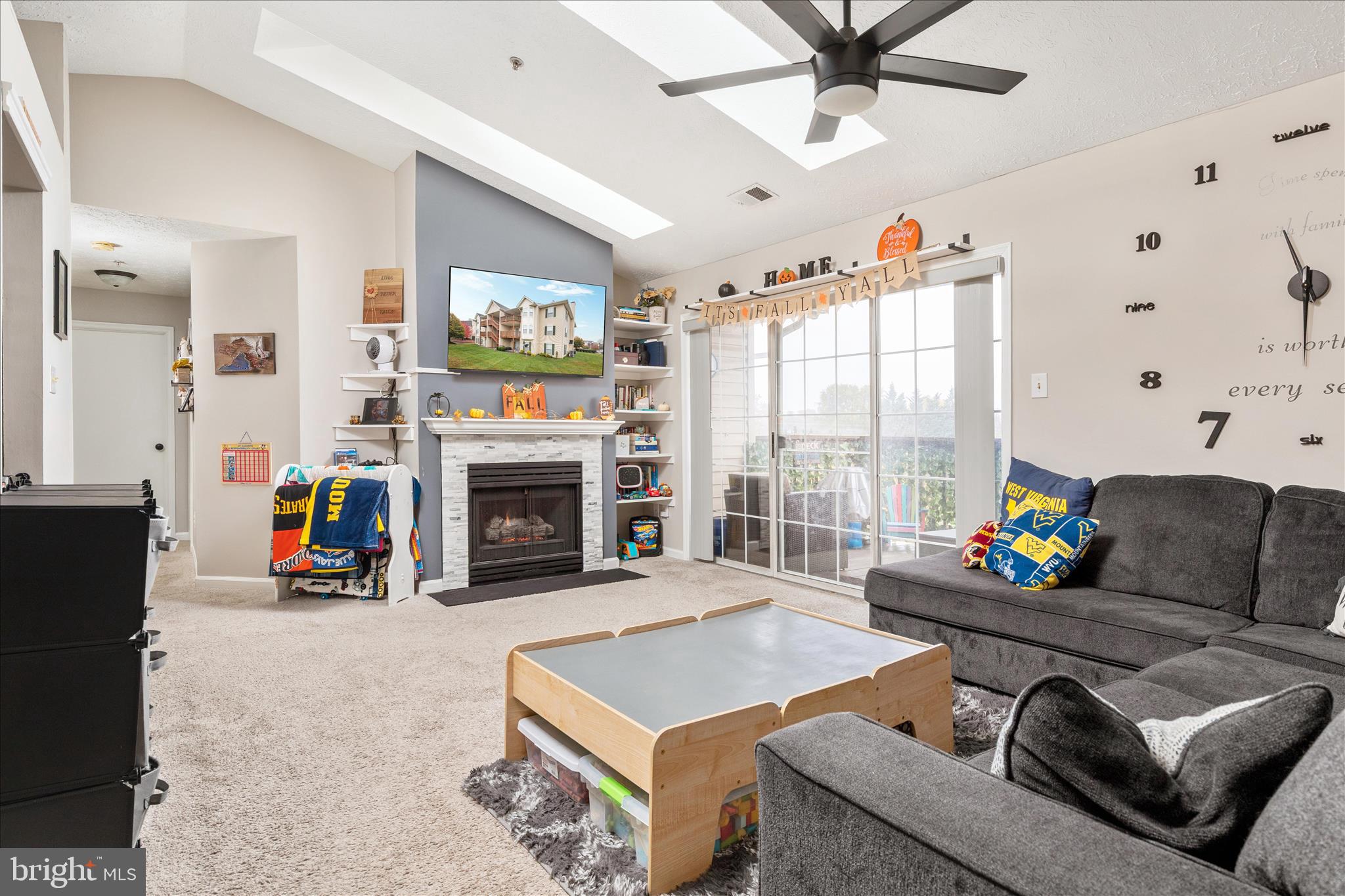 157 Brookland Terrace, Unit 11 Winchester, VA 22602 - Photo 7 of 22 a living room with furniture and a fireplace