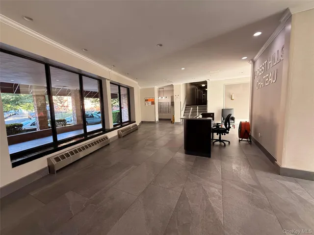 a living room with furniture and flat screen tv