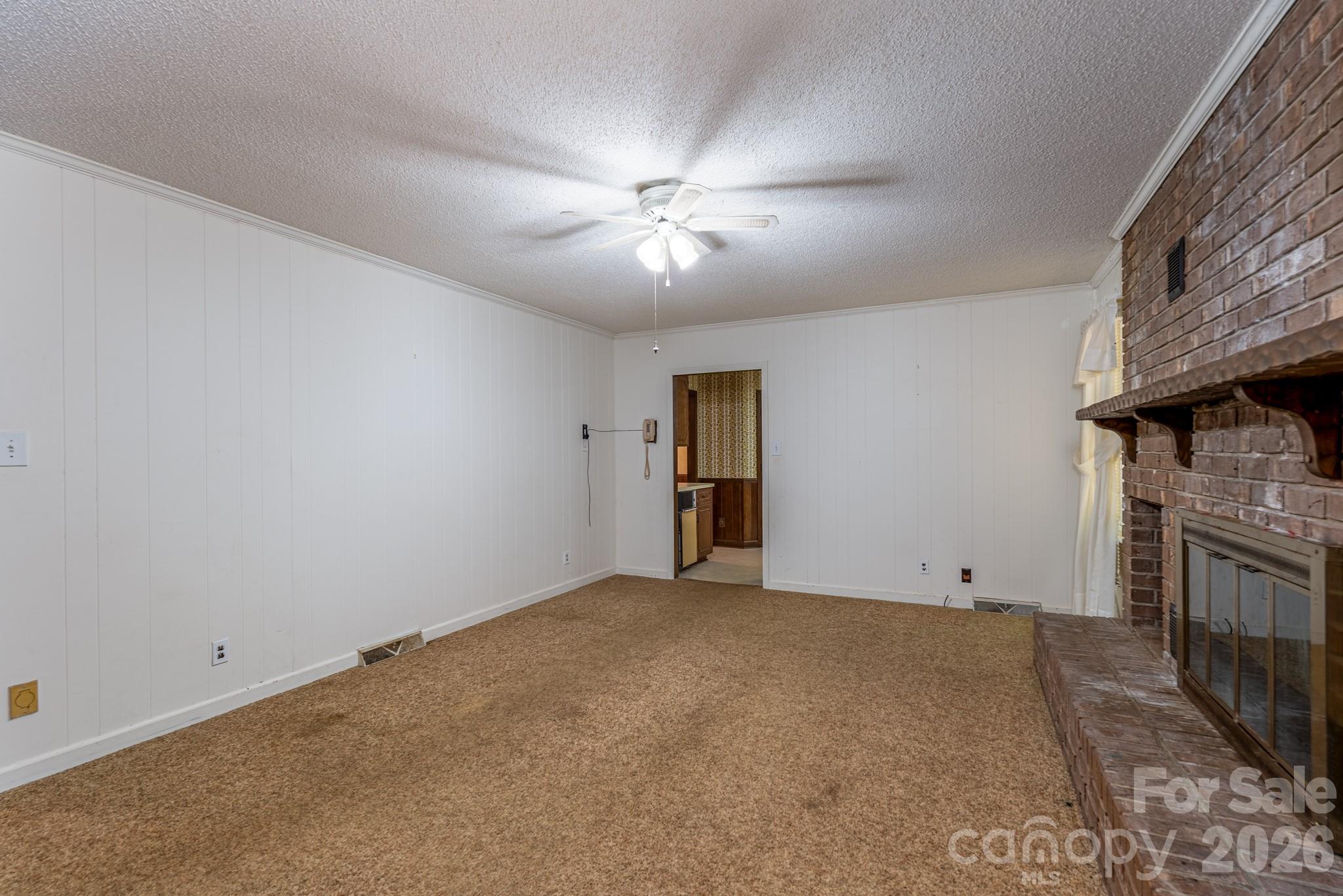 1836 Westbrook Road Edgemoor, SC 29712 - Photo 11 of 47 a view of an empty room with a fireplace