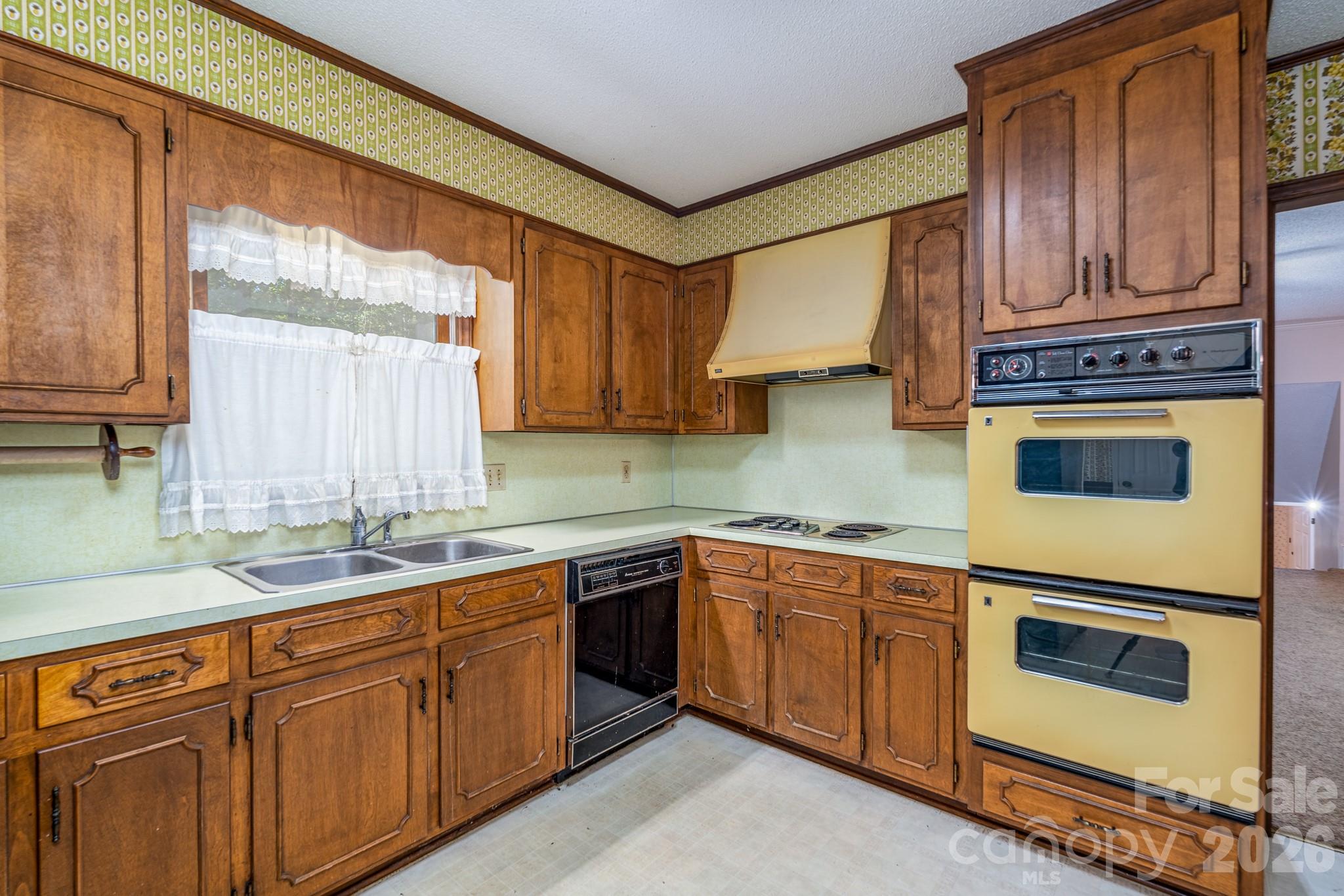 1836 Westbrook Road Edgemoor, SC 29712 - Photo 13 of 47 a kitchen with stainless steel appliances granite countertop a sink a stove and cabinets