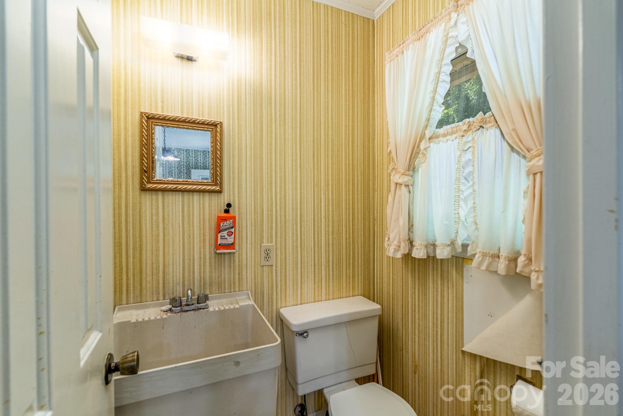 1836 Westbrook Road Edgemoor, SC 29712 - Photo 16 of 47 a bathroom with a sink and a toilet