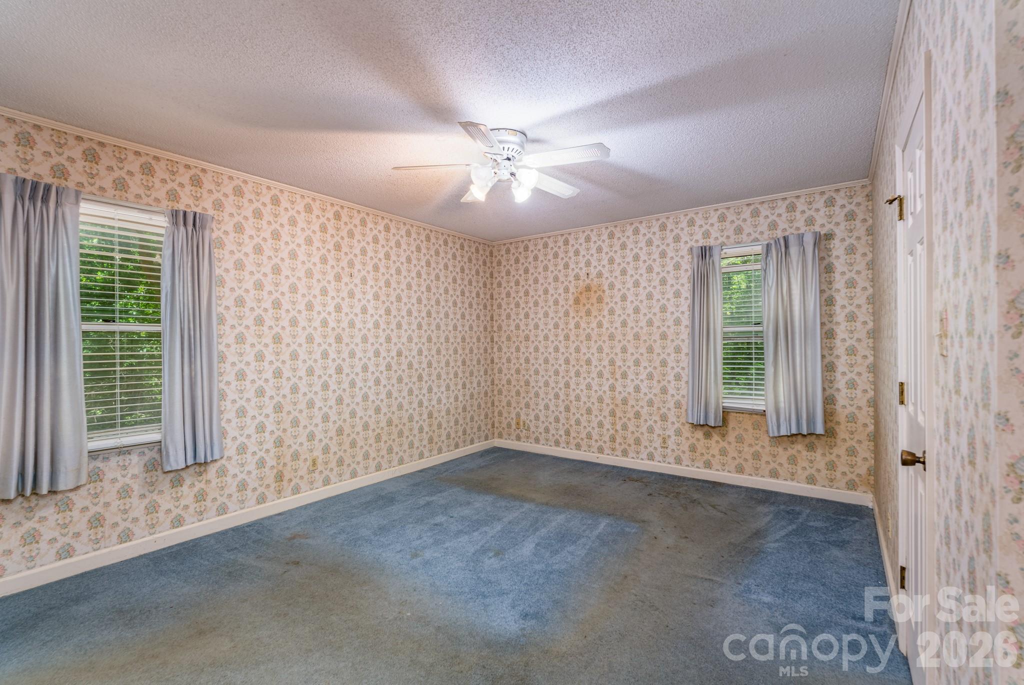 1836 Westbrook Road Edgemoor, SC 29712 - Photo 22 of 47 an empty room with windows and fan