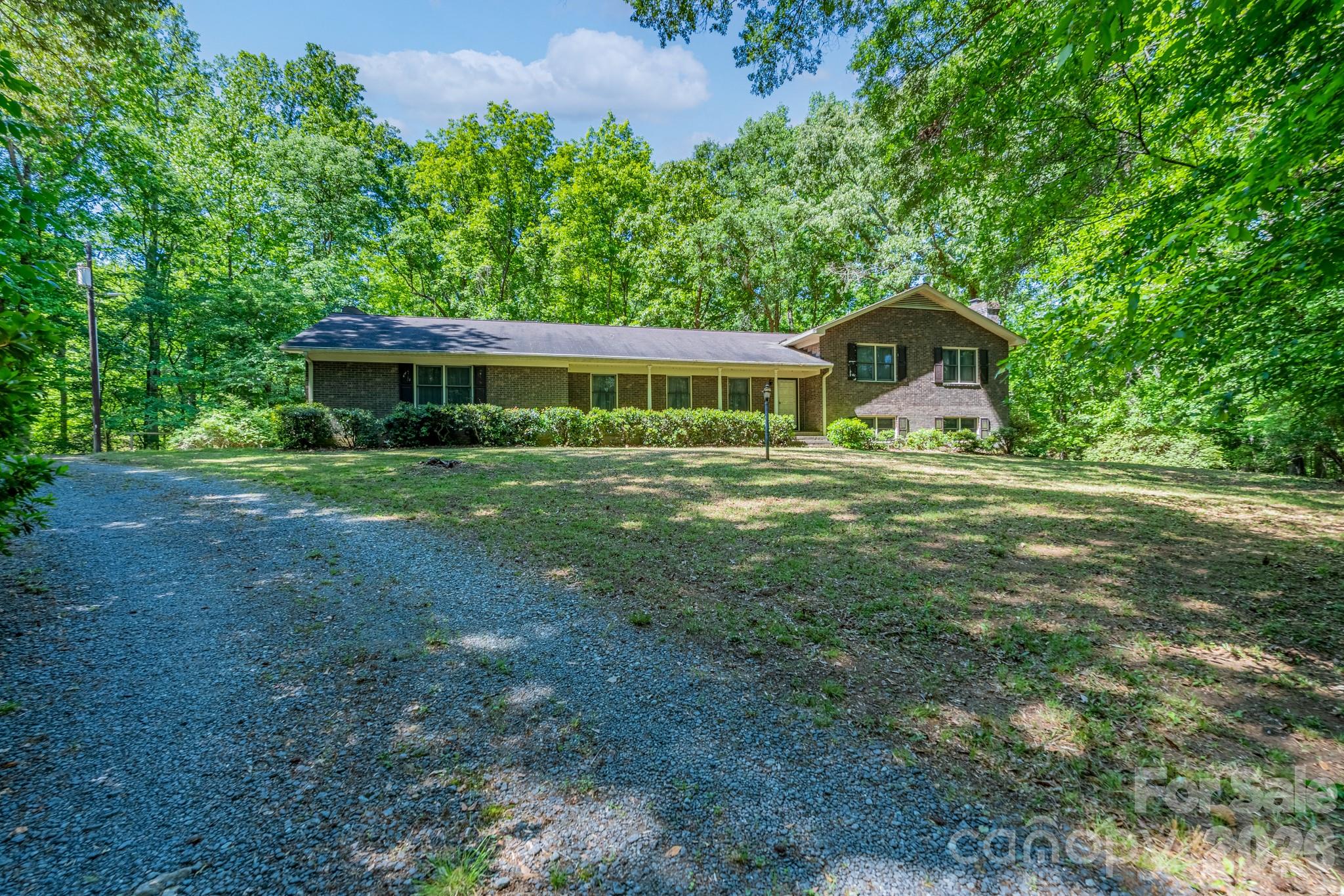 1836 Westbrook Road Edgemoor, SC 29712 - Photo 32 of 47 a front view of a house with garden