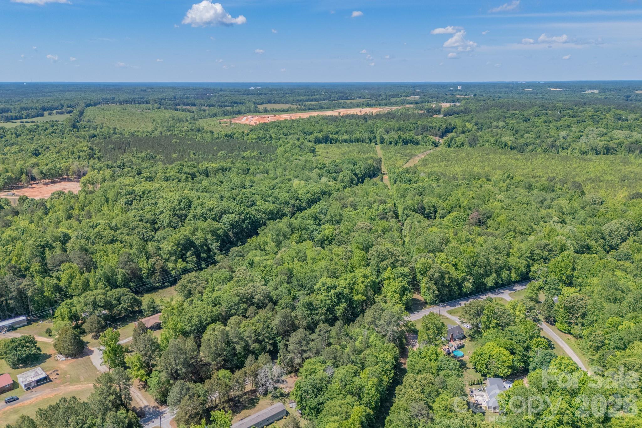 1836 Westbrook Road Edgemoor, SC 29712 - Photo 37 of 47 a view of a green field with lots of bushes