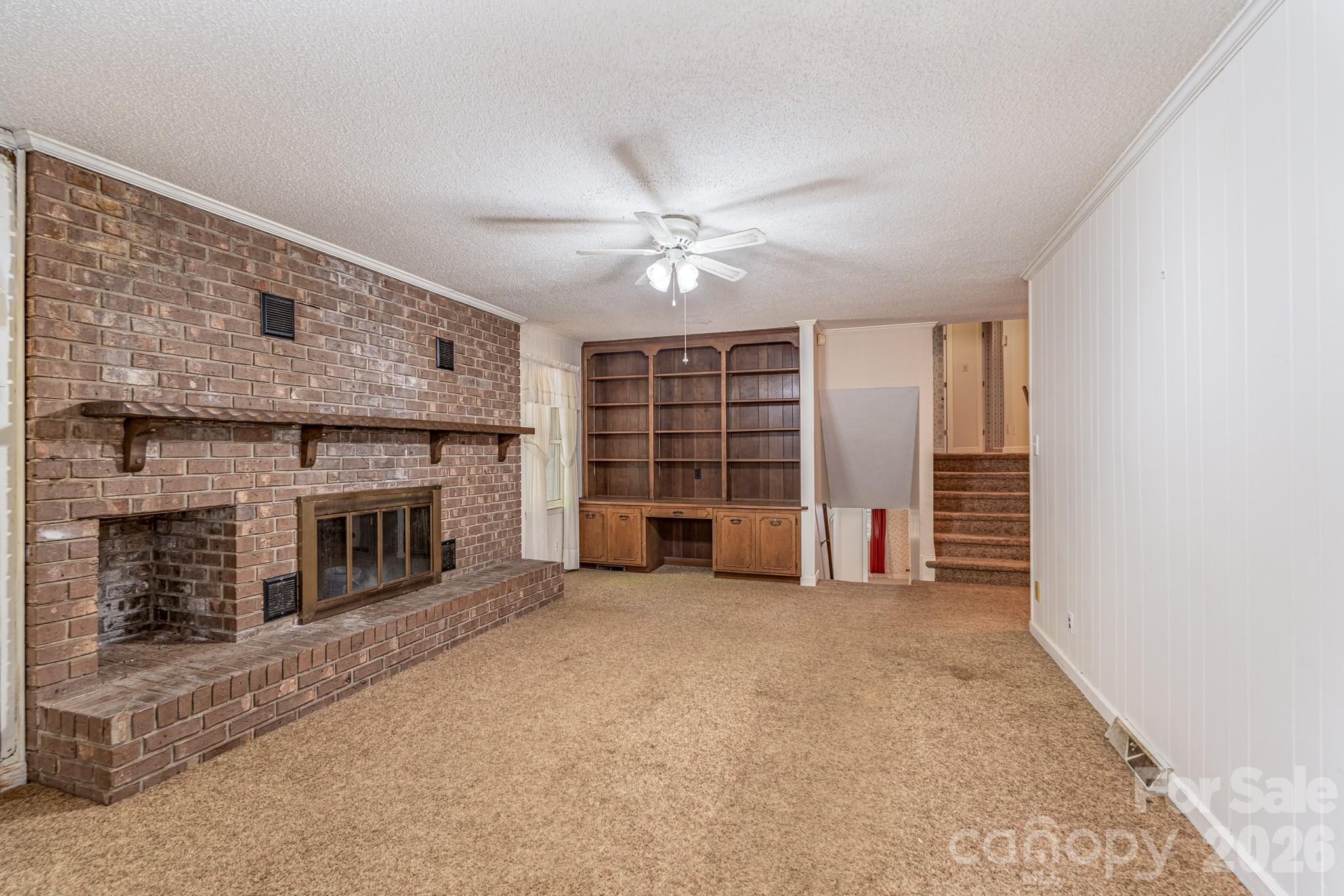 1836 Westbrook Road Edgemoor, SC 29712 - Photo 9 of 47 an empty room with furniture and fireplace