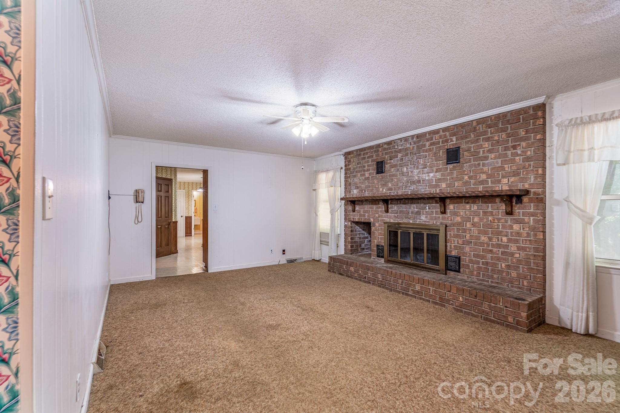 1836 Westbrook Road Edgemoor, SC 29712 - Photo 10 of 47 a view of empty room with a fireplace