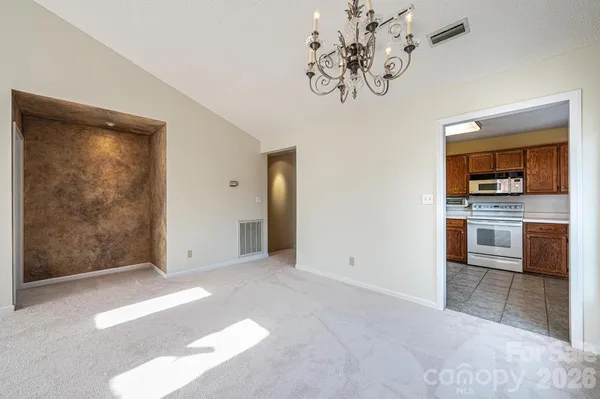 a view of a kitchen with a sink and cabinets