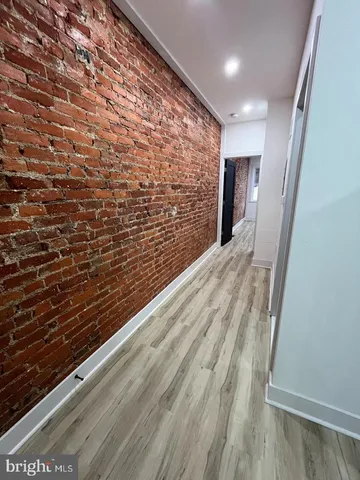 a view of balcony with wooden floor