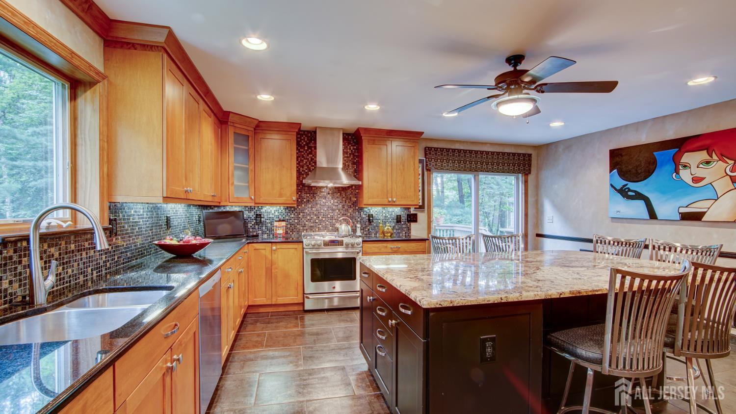 15 Timber Road East Brunswick, NJ 08816 - Photo 12 of 40 a kitchen with stainless steel appliances granite countertop a sink stove and refrigerator