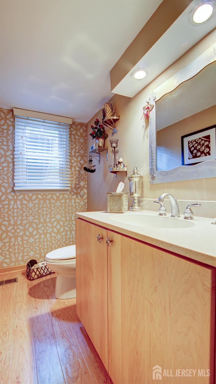 15 Timber Road East Brunswick, NJ 08816 - Photo 19 of 40 a bathroom with a sink mirror vanity and toilet