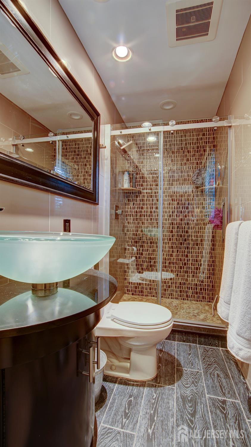 15 Timber Road East Brunswick, NJ 08816 - Photo 27 of 40 a bathroom with a sink toilet and shower