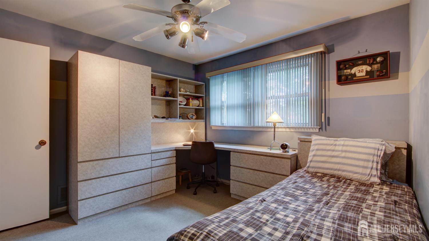15 Timber Road East Brunswick, NJ 08816 - Photo 30 of 40 a room with a bed and furniture