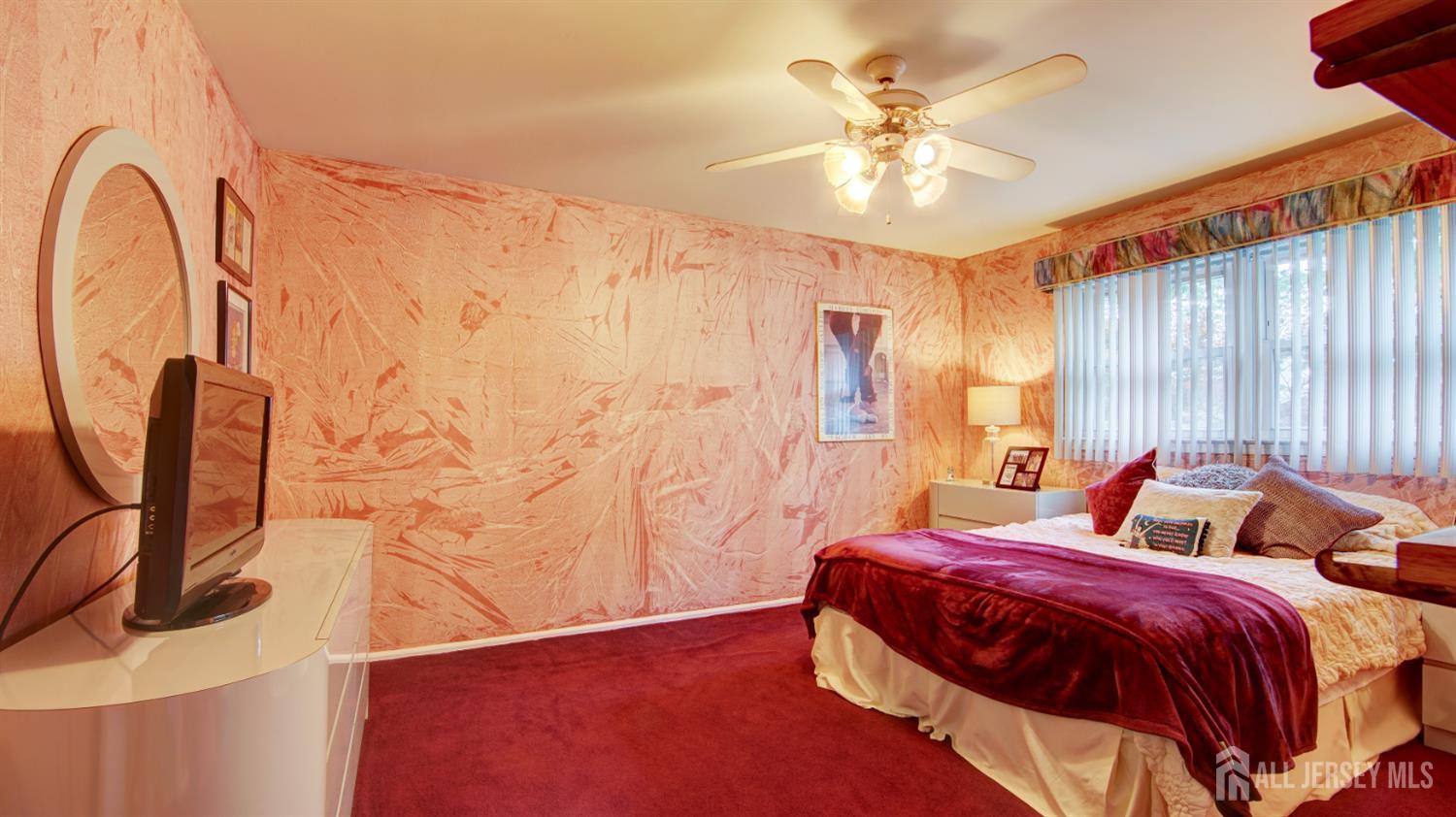 15 Timber Road East Brunswick, NJ 08816 - Photo 31 of 40 a bedroom with a bed and a chandelier