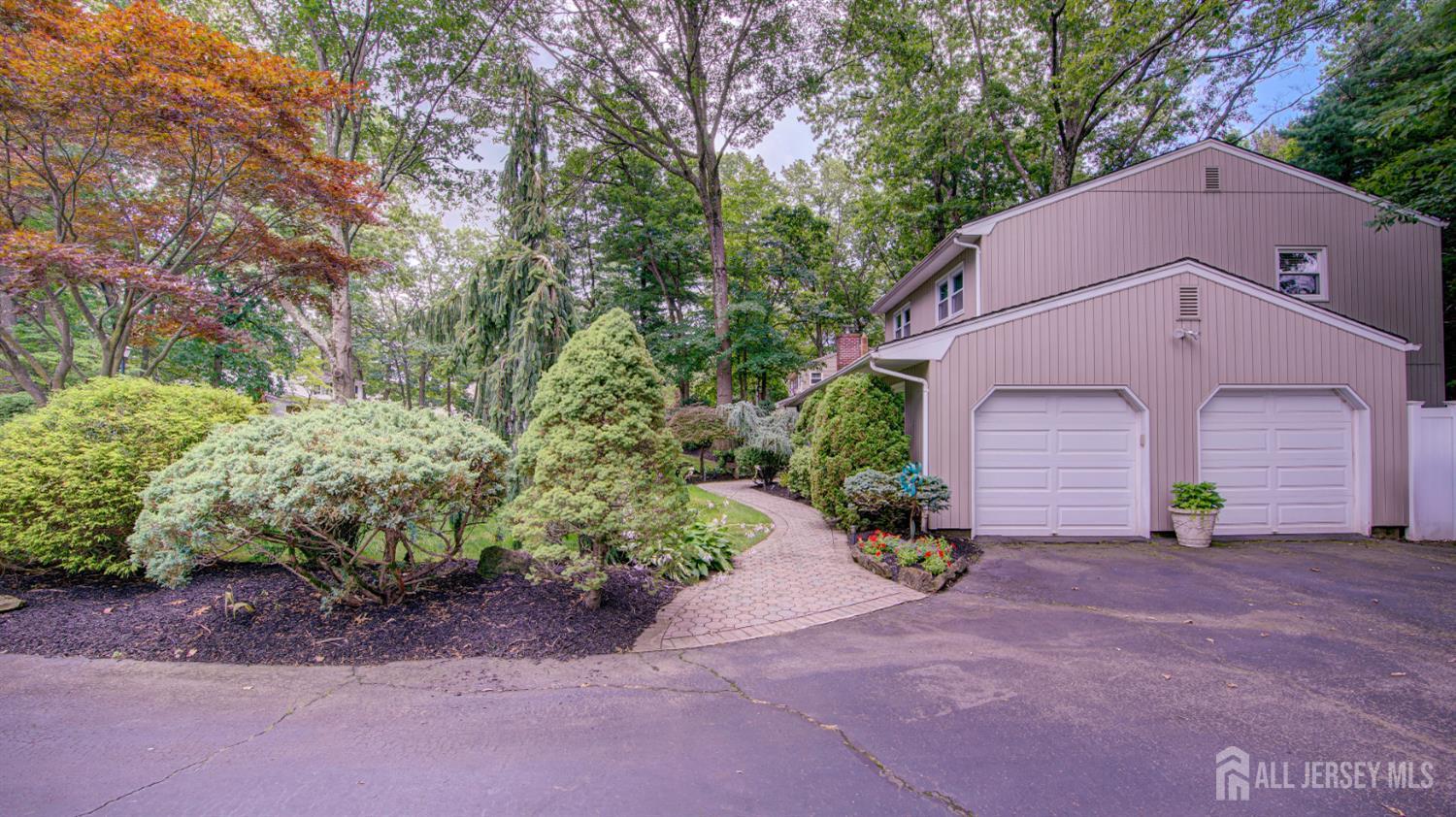15 Timber Road East Brunswick, NJ 08816 - Photo 5 of 40 a front view of a house with a yard and garage