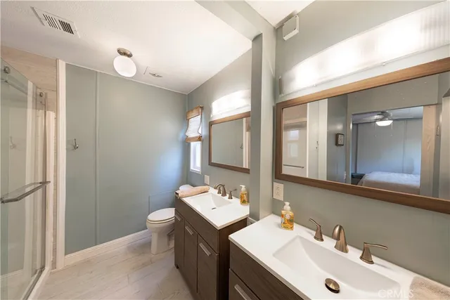 a bathroom with a sink double vanity and a mirror