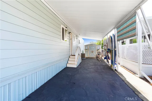 a view of a swimming pool with furniture