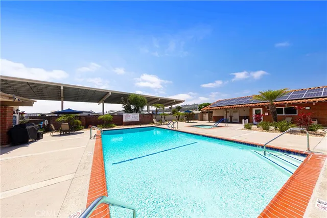 a view of a swimming pool with lounge chairs