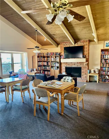a view of a dining hall with lots of tables and chairs